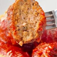 Spaghetti & Meatballs · Bed of spaghetti, 2 meatballs, marinara, grated parmesan. Served with our classic garlic bre...