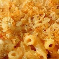 Kids Mac & Cheese · Macaroni elbows tossed with our creamy cheese sauce and baked with breadcrumbs. Served with ...