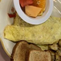 Plaza Omelet · Eggs, bell peppers onions, cheese, ham bacon and sausage with home potatoes.  Served with to...