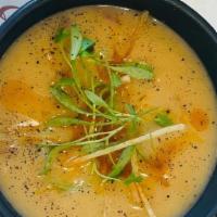 Tortilla Soup (V) · Tortilla soup, Cilantro, onion, chipotle oil, jalapeno ash, topped with avocado slices and t...