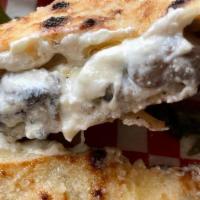 Truffle Ricotta Calzone · Truffle calzone with truffle mushrooms, ricotta and fresh mozz.