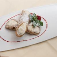 Cannoli · A Sicilian speciality. Hard shell filled with ricotta cheese, chocolate chips and lemon zest.