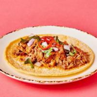 Chipotle Braised Chicken Taco · Chipotle tomatillo chicken with onion, cilantro, & fermented fresno chili