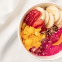 Tropical Bowl · Blend of pitaya, banana, mango, pineapple and apple juice. Topped with granola, Strawberry, ...