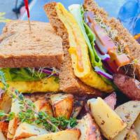 Breakfast Sandwich · Whole Wheat Toast, Eggs, Cheddar Cheese, Tomato, Lettuce, Sprouts, Red Onion, Chipotle Mayo
