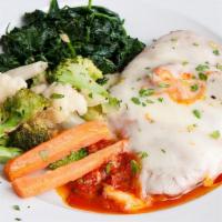Vegetarian Eggplant Parmigiana · Garden fresh eggplant breaded and sautéed in a lightly seasoned oil, served with tomato sauc...