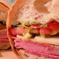 Italian Deli Sandwich · Salami, prosciutto, ham, pepperoni, Provolone, lettuce, tomato, pepperoncini, on ciabatta wi...