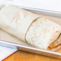 Carne Asada Burrito · Traditional-style with grilled steak, Spanish rice, black beans, salsa, chopped onion, and c...