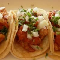 Chicken Tacos · Three soft corn tortillas, grilled chicken breast, salsa, onion, cilantro.
