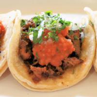 Carne Asada Tacos · Three soft corn tortillas, grilled steak, salsa, onion, cilantro.