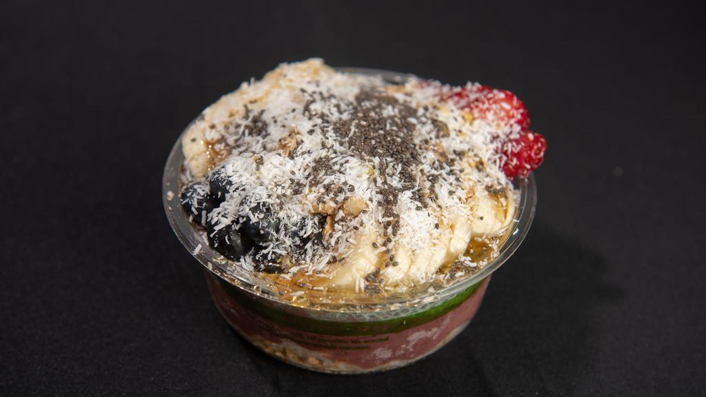 Bowl #4 · Acai, spirulina chia pudding, vanilla almond granola, strawberry, blueberry, banana, chia seeds, shredded coconut and honey.