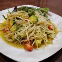 Papaya Salad · Gluten-free. Thai traditional green papaya salad with peanut, cherry tomatoes, string bean, ...