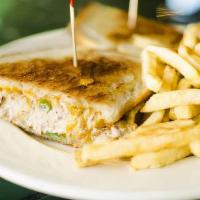 Tuna Melt Sandwich · Grilled albacore tuna salad and melted Cheddar cheese on grilled sourdough bread.