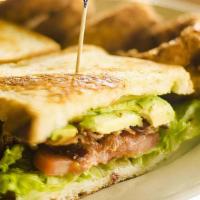 Blt Sandwich · Bacon, lettuce, tomato, and mayonnaise on grilled sourdough bread.