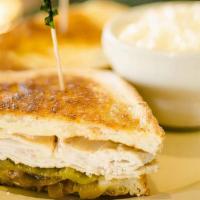 Turkey Melt · Fresh roasted turkey with grilled onions, green chile, tomatoes, Jack cheese, and thousand i...