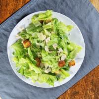 Chicken Caesar Salad · Romaine hearts, Caesar dressing, garlic croutons, Parmesan cheese, lemon.
