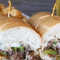 Philly Cheese Steak · Our original Philly cheesesteak with grilled onion, bell peppers and melted Swiss cheese ser...