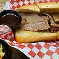 Bbq Brisket Sandwich · Our mouth-watering brisket is slowly smoked to perfection.  Includes a small (5oz) side of y...