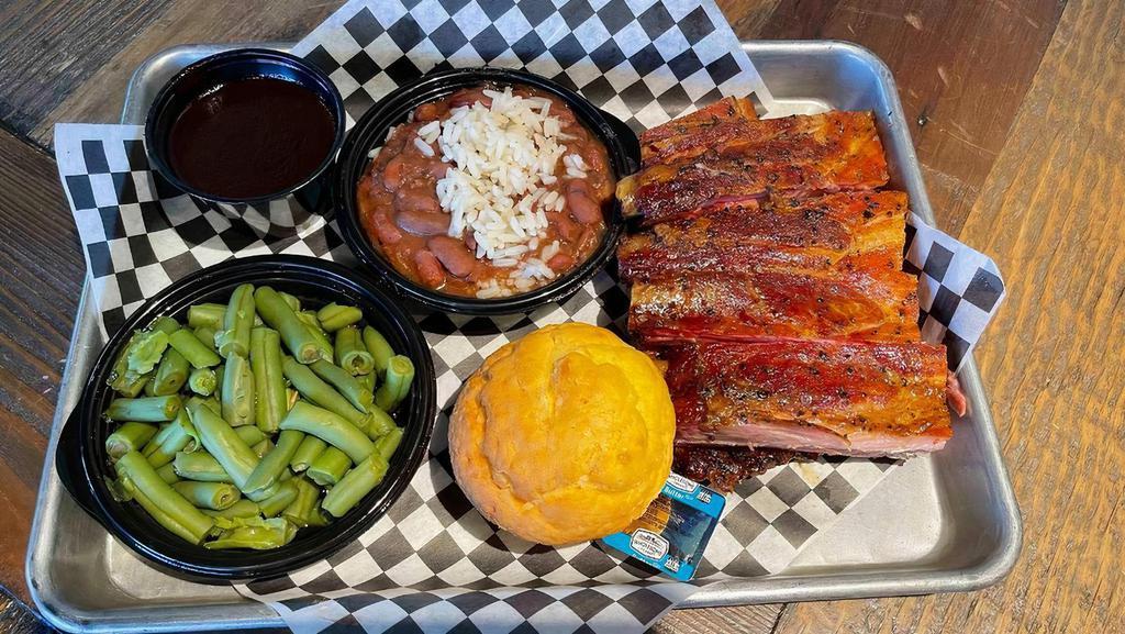 Pork Ribs · Perfectly seasoned Pork Ribs, slowly smoked over Oak Wood for an incredible authentic flavor. Definitely a popular choice and fan favorite!  Includes two sides of your choice and a dinner roll.