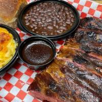 1/2 Slab · Our ribs are slow smoked and tender.  This half slab will satisfy any craving.  Includes two...