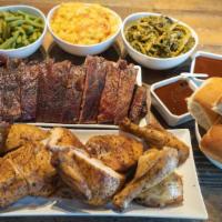 The Get Down Party Pack (10-12 People) · Your choice of two meats (2 lbs each) your choice of three XL sides (32oz each), and 10 dinn...
