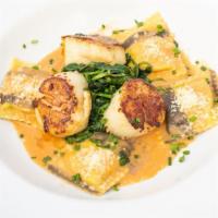 Fresh Jumbo Scallops · Pan seared fresh scallops | champagne tomato lobster sauce | house made lobster ravioli.