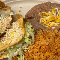 2 Beef Tacos · 2 Crispy Shredded Beef tacos lettuce & cheese,rice and beans.