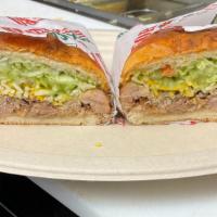 Carnitas Torta · Served with mayonnaise, guacamole, cheese and lettuce