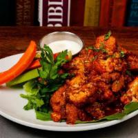 Buffalo  Cauliflower · Tossed in buffalo sauce. served with ranch, blue cheese, celery, carrots