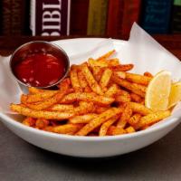 Cajun Fries · Shoestring fries, New Orleans cajun seasoning, parsley, lemon, ketchup