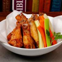 Naked Wings · Deep fried jumbo size chicken wings (8 pieces) tossed served with celery, carrot. choice of ...