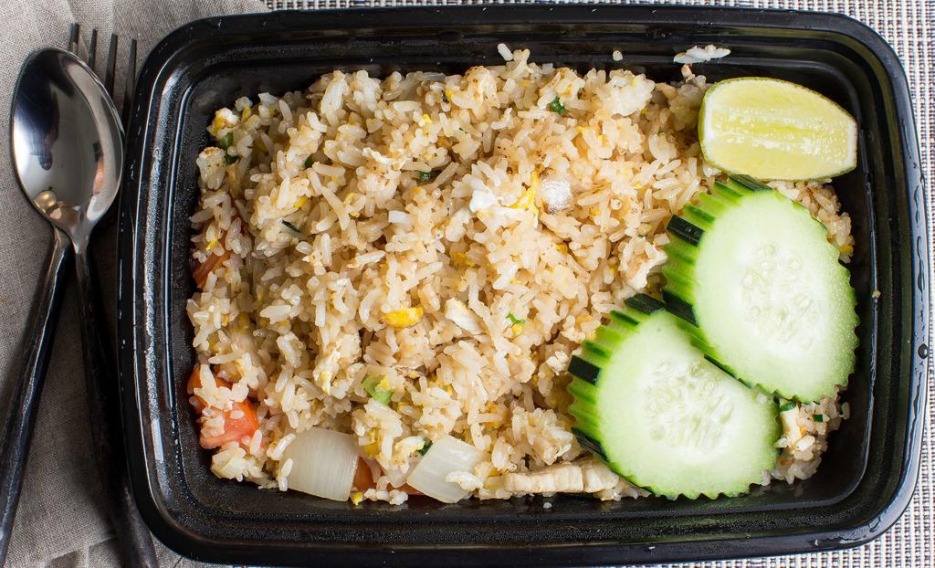 Thai Fried Rice · Gluten free. Most popular. Thai jasmine rice stir-fried with your choice of meat, egg, garlic, onion, peas, carrots and green onions. Garnished with cucumber, tomatoes and cilantro.