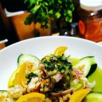 Ceviche Of The Day · Lime juice, red onion, serrano chile, cucumber, garnished with pico & avocado, served with 3...