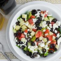 Greek Salad · Lettuce, chopped tomatoes, cucumber, black olives and Greek feta cheese served with vinegar ...