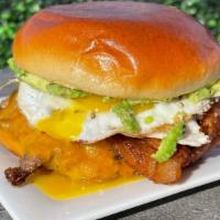 Sunshine Burger · Our famous 1/2 lb. Atlas burger topped with bacon, fried egg, avocado, ketchup, and mayo.