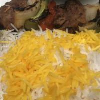 Shish Kabob (Filet Mignon) · Chunks of filet mignon served alongside skewer of fire-roasted vegetables (tomatoes, onions ...