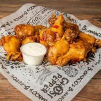 Bone In Wings · Bone-in wings tossed in choice of sauce. Never breaded! Fried a bit well done...as they shou...