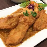 Tamarind Fish · Medium spicy. Deep fried battered fillet swai fish and served with egg flower tamarind sauce.