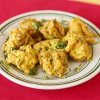 Mixed Vegetable Pakora · Assorted vegetables mixed with chickpea dough and spices, deep fried.
