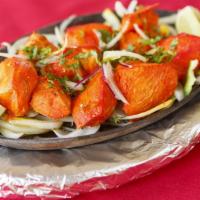Chicken Tikka · Boneless (white meat) chicken pieces marinated in herbs and spices, roasted tandoori style w...
