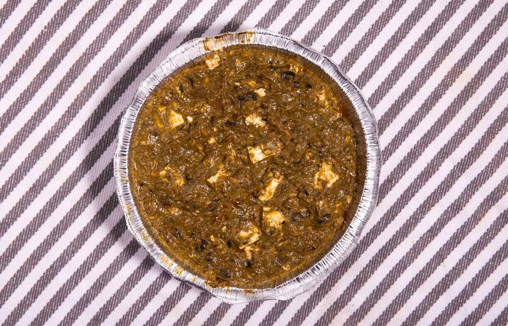 Chicken Saag · Curried chicken cooked with chopped fresh spinach in a creamy sauce.