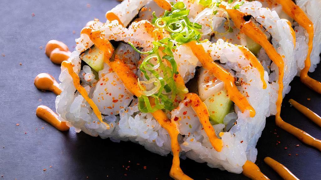 (E041) Spicy Scallop Roll · Eight pieces. Spicy. Scallop, avocado and cucumber roll. Topped with spicy mayonnaise, chili powder and green onion.