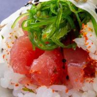 (C029) Tuna Poke Hand Roll · Tuna and seaweed salad, poke sauce and wrapped in soy paper.