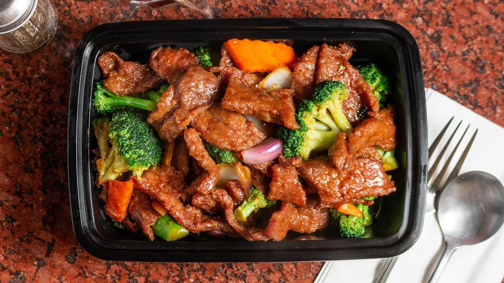 Beef With Broccoli · Stip of tender beef toss-cooked with crispy green broccoli, and carrot.