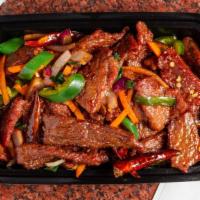 Mongolian Beef · Sliced beef quick fried with bamboo shoots and green onions, carrot in a special sauce.