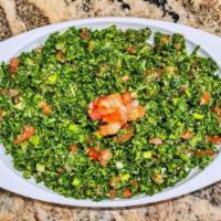 Tabbouleh · The traditional Mediterranean salad, made with chopped parsley, diced tomatoes, green onions...