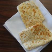 Super Quesadilla Suiza · Served with choice of meat, flour tortilla with melted cheese, sour cream, guacamole and sal...