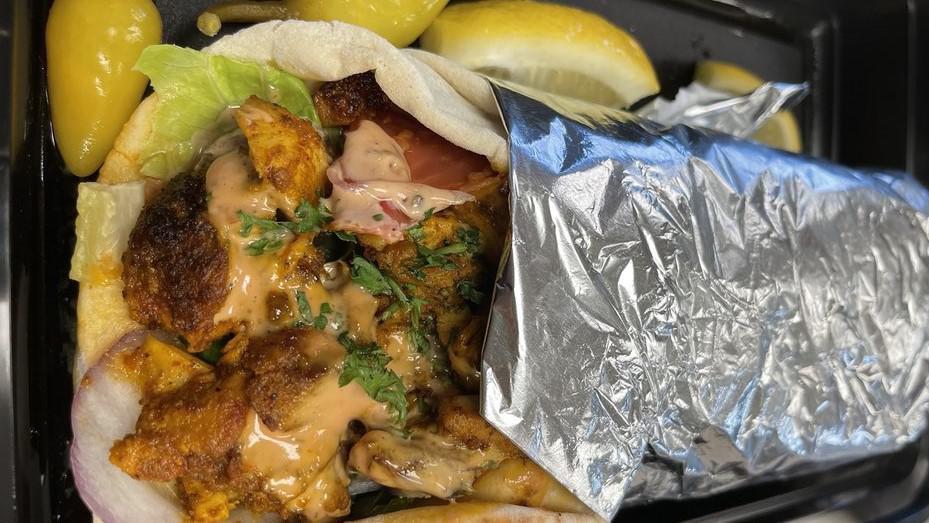 Chicken Shawarma Wrap · Comes with French fries  and can of soda.