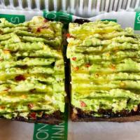Hass Avocado Toast · Contains gluten and egg. Olive oil, grilled gjusta ciabatta, lemon, and crushed red chili.