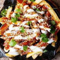 Mole Fries · Cotija cheese, crema, and pico de gallo.